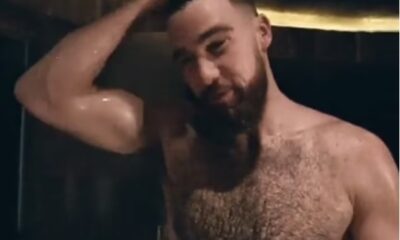 Travis Kelce has got Taylor Swift fans hot under the collar on social media after a viral video showed him topless with a towel wrapped around his waist pic