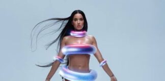 Katy Perry Looks Like an Alien on the Beach Wearing Iridescent Rubber Rings as a swimsuit see full photos and video…