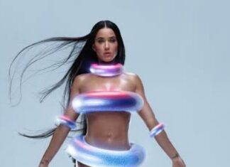 Katy Perry Looks Like an Alien on the Beach Wearing Iridescent Rubber Rings as a swimsuit see full photos and video…